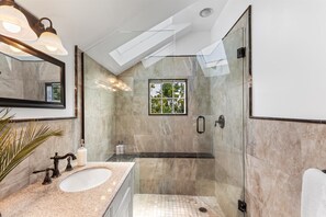 Shower, eco-friendly toiletries, hair dryer, towels