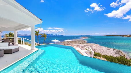 Pool. Stunning 6 bedroom waterfront villa with private wooden dock