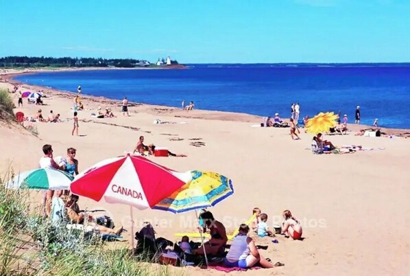Guests can enjoy a serene beach experience with calm seas and clear skies.