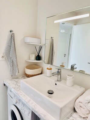 Shower, hair dryer, towels, soap