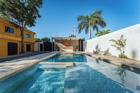Outdoor pool, sun loungers. Hotel MID Project