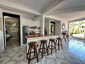 Fridge, microwave, coffee/tea maker, cookware/dishes/utensils