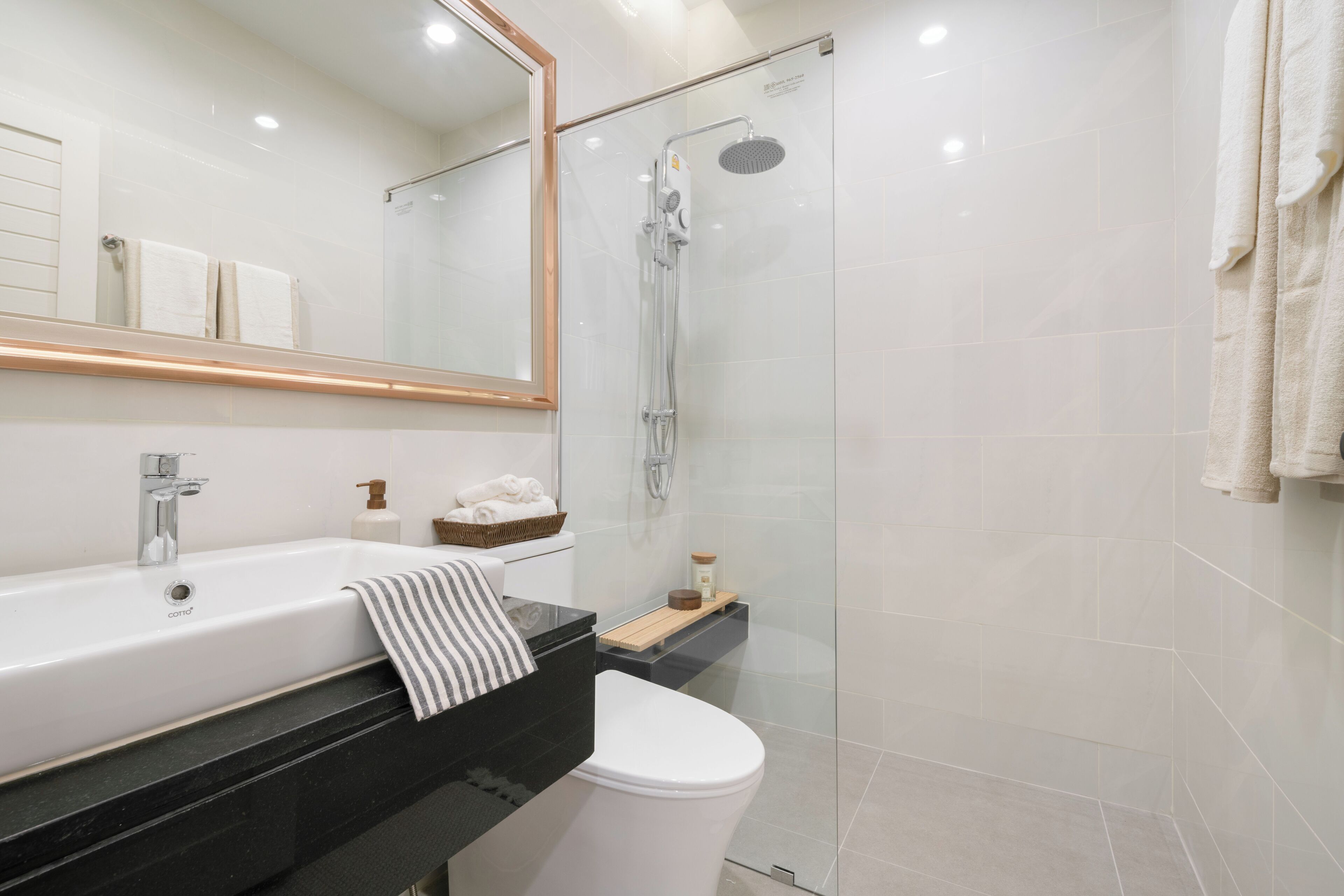 Shower, rainfall showerhead, hair dryer, towels