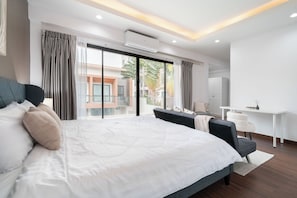 Desk, blackout drapes, iron/ironing board, free cribs/infant beds - Chao Wilai Residence | Naiyang Beach | HKT Airport (Sa Khu)
