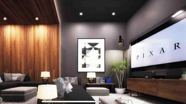 A modern living room with a large flat-screen TV, wooden panel walls, a sofa, a coffee table, and a side table with a lamp. - Loft Estudio Cdmx Alberca y Gym / Smart Penthouse (Ciudad de México)