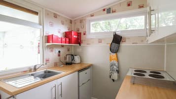 Fridge, electric kettle, toaster, cookware/dishes/utensils