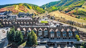 A large building with a symmetrical facade, multiple windows, and a parking area in front. - Labor Day Sale - Limited Time Offer, Save up to 30% (Park City)