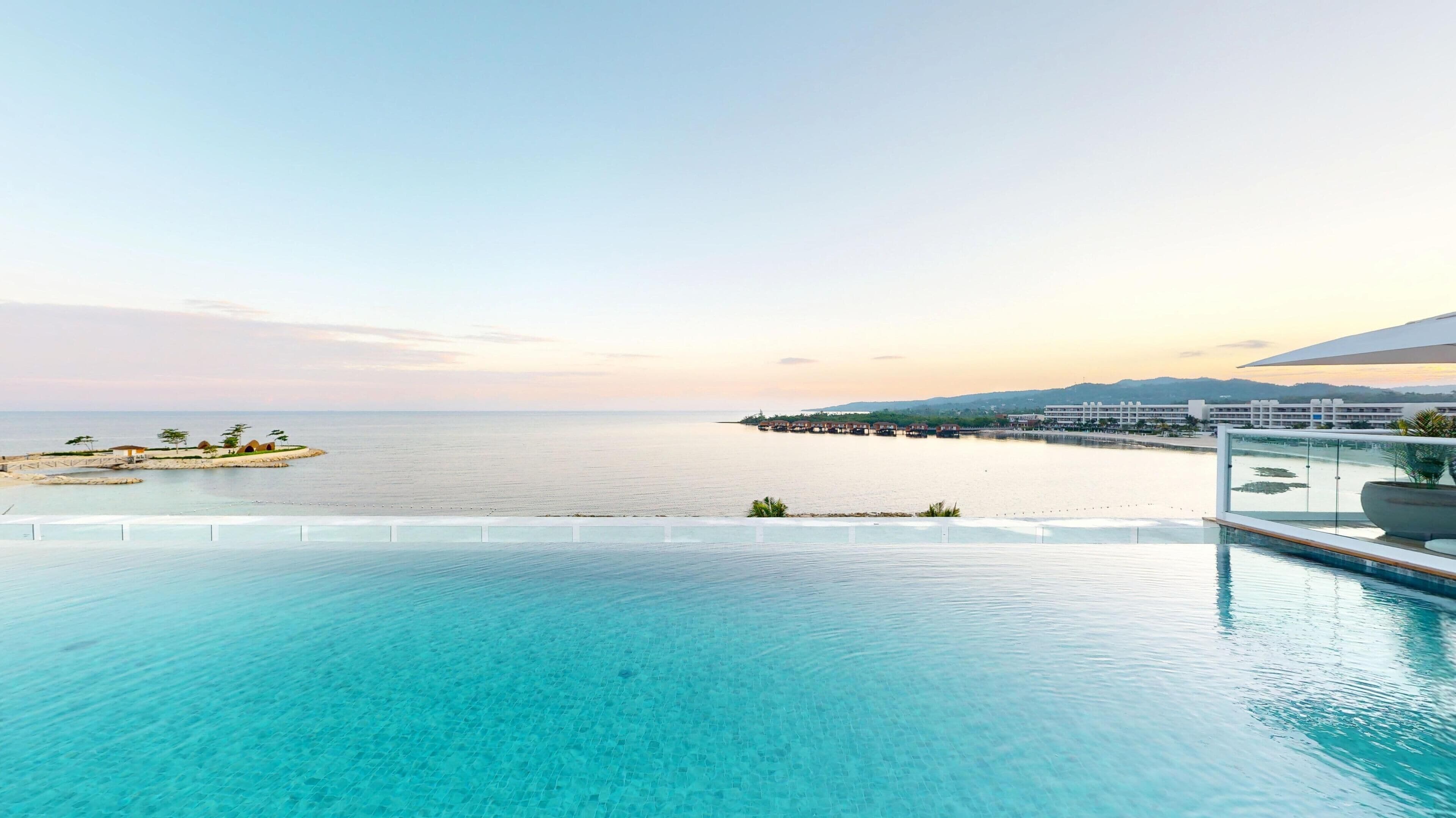 On the beach, white sand, beach cabanas, sun-loungers