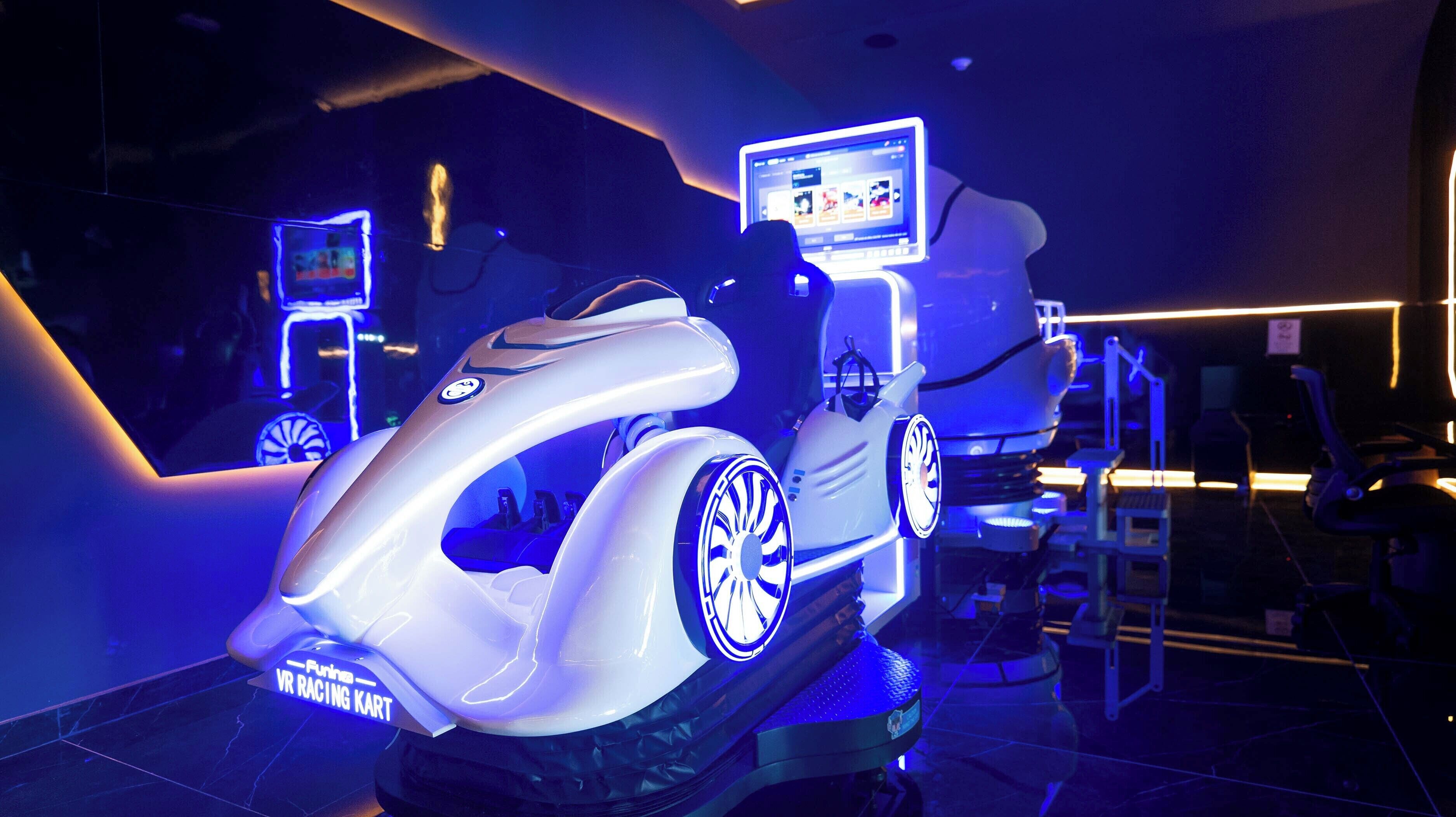 A VR racing kart with a digital screen and a logo on the side.