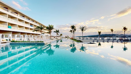 4 outdoor pools, cabanas (surcharge), sun loungers. Princess Grand Jamaica Resort - All Inclusive