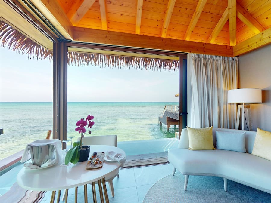 Over Water Villa with Infinity Pool | Living area | 55-inch Smart TV with cable channels