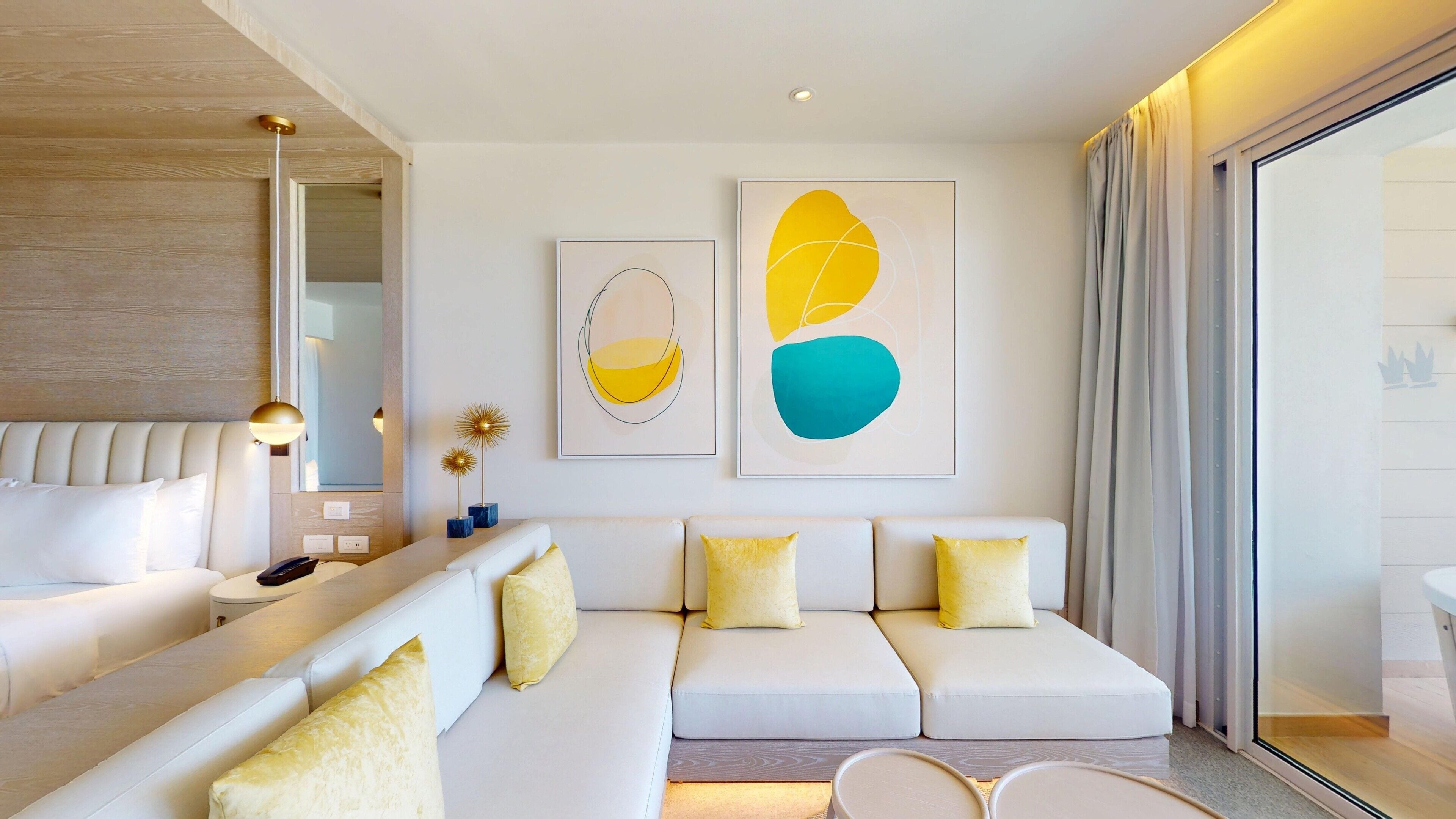 A modern living room with a sofa, a coffee table, and a lamp.