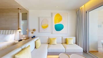 A modern living room with a sofa, a coffee table, and a lamp.