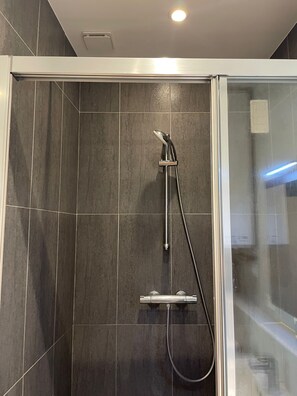 Shower, towels, soap, toilet paper