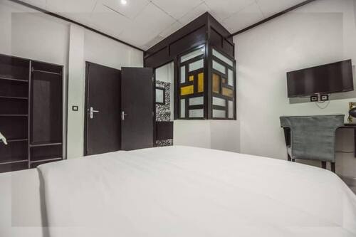 Chambre Confort double | Draps en coton égyptien, literie de qualité, couette en duvet