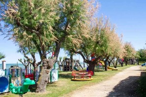 A playground with swings, slides, and climbing structures.