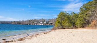 Cape Cod pet friendly home with deck with gas grill, back yard patio with fire pit, and central AC