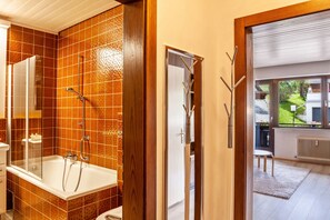 Bathtub, hair dryer, towels