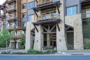 A multi-story lodge with stone and wood exterior, balconies, and a sign reading 'SILVER STRIKE LODGE'.