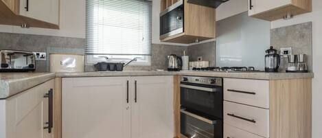 Fridge, electric kettle, toaster, cookware/dishes/utensils