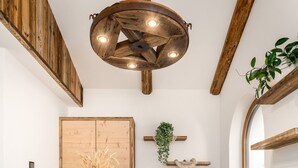 A reception desk with a wooden finish and the name 'Forchnerhof' displayed. - Holiday Apartment "Forchnerhof 4" with Mountain View, 2 Private Terraces & Wi-Fi (Terenten)