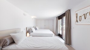 A hotel room with two beds, a large window with curtains, and a wall with a 'Love' artwork. - Holiday Home 'Dream Property In Alconasser' with Sea View, Pool, Terrace & Wi-Fi (Sóller)