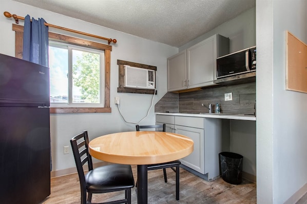 Fridge, microwave, stovetop, coffee/tea maker