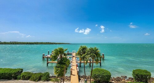 Clocked Out townhouse-style condo offering 2 bedrooms and 2.5 baths with pool & dockage