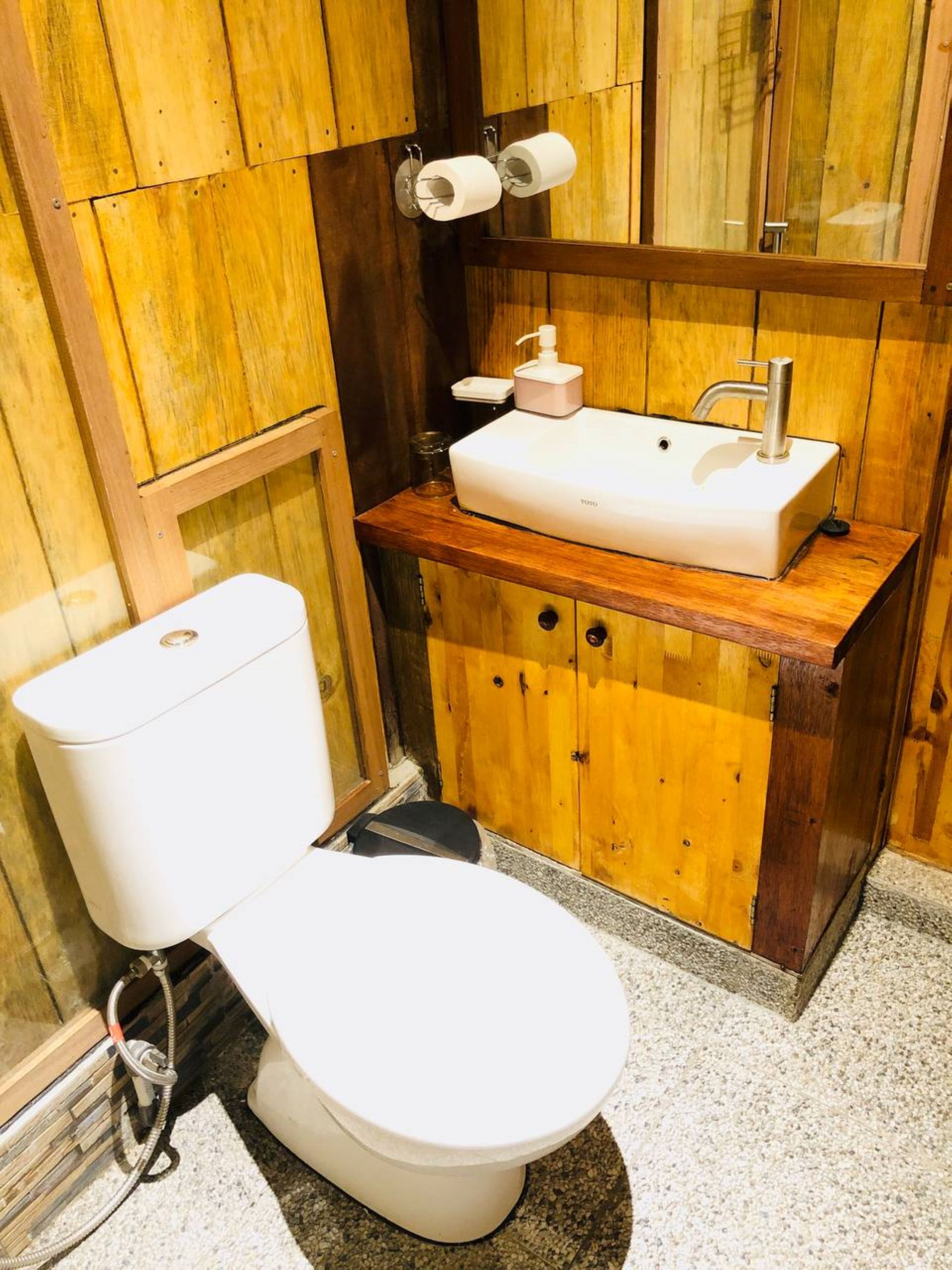 deluxe room | bathroom | shower, slippers, towels, soap