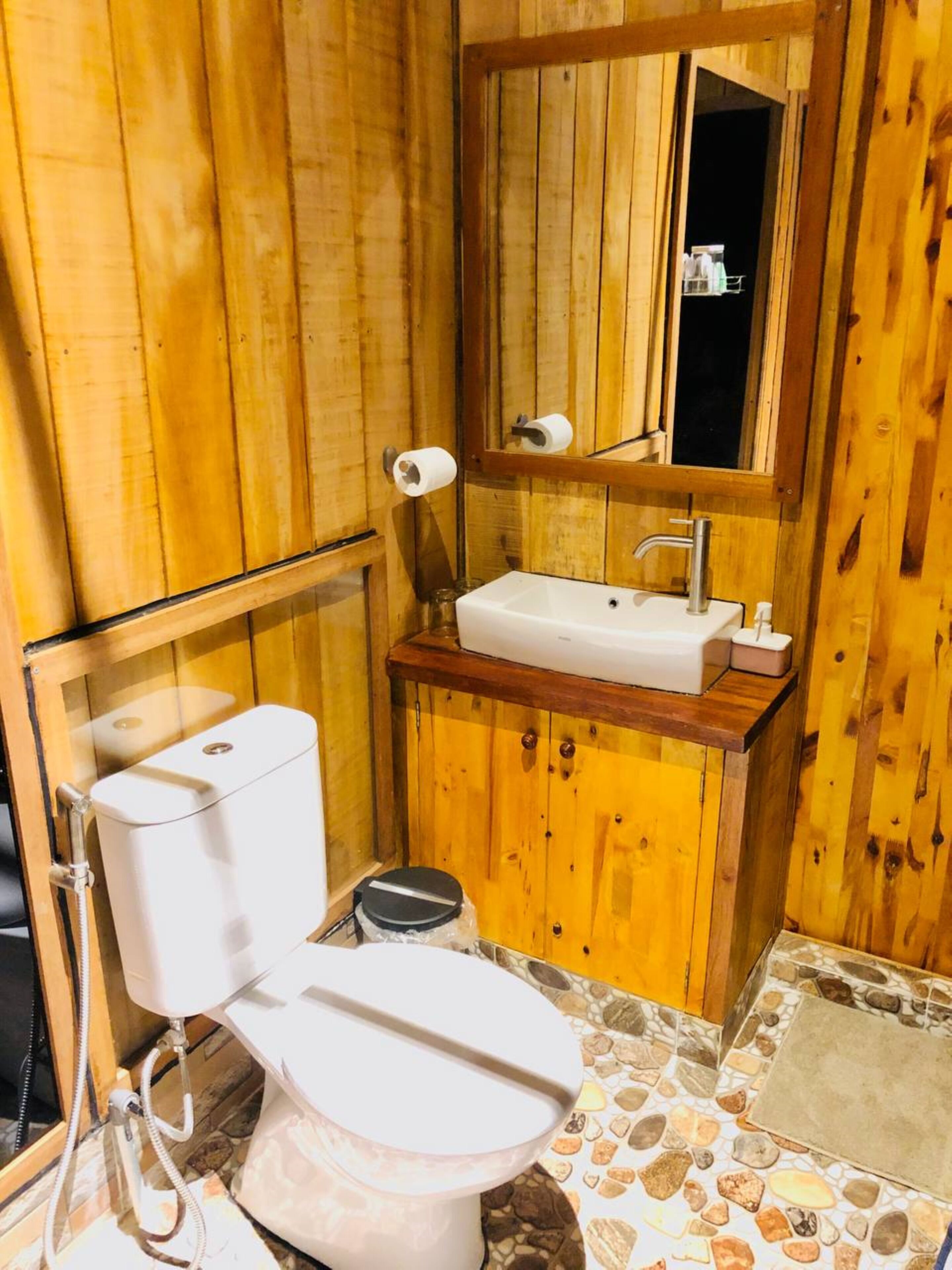 deluxe room | bathroom | shower, slippers, towels, soap