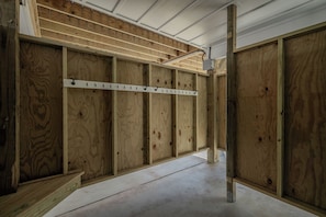 A construction site with exposed wooden framing and a metal measuring tape. - Slow M'Ocean: Large, Modern Home with a Pool, Elevator and Hot Tub! (Oak Island)