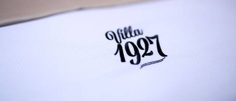 A close-up of a white surface with the text "Villa 1927" in a stylized font.