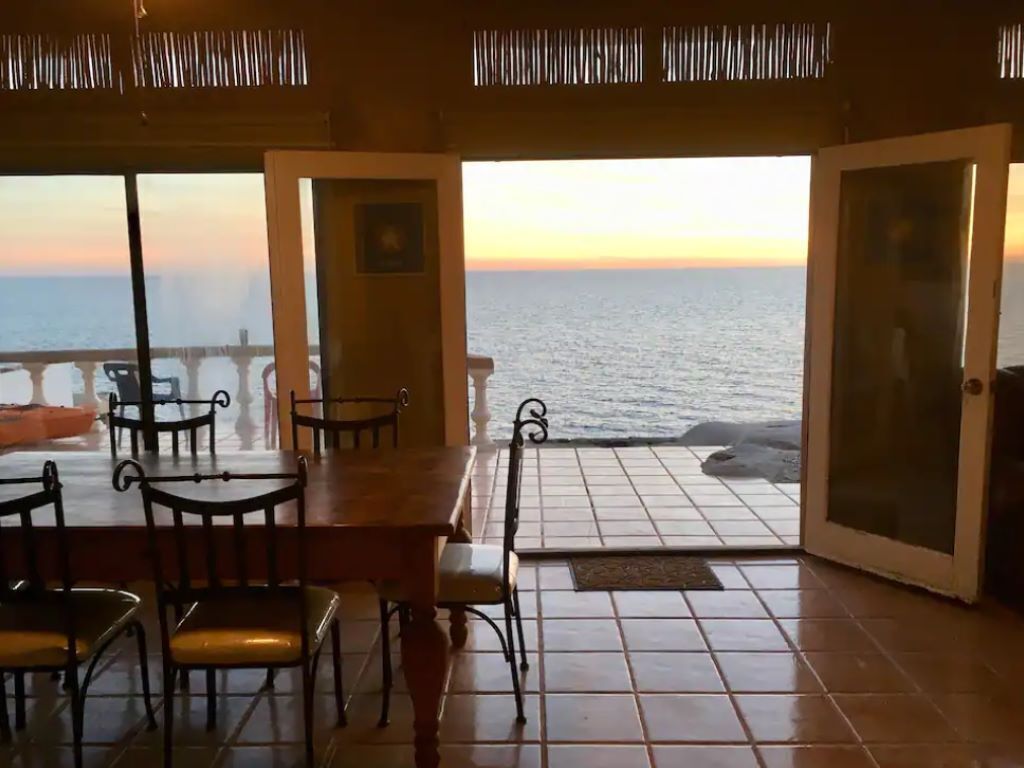 Living/Dining room/Patio looking out to the ocean