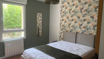 1 bedroom, desk, iron/ironing board, travel crib