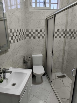 Shower, hair dryer, towels, soap