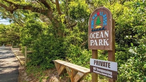 A sign for Pine Knoll Ocean Park indicating it is private and no trespassing.