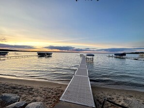 On the beach, sun-loungers, beach towels - Beautiful lake home on the sandy south shores of Pelican Lake. (Nisswa)