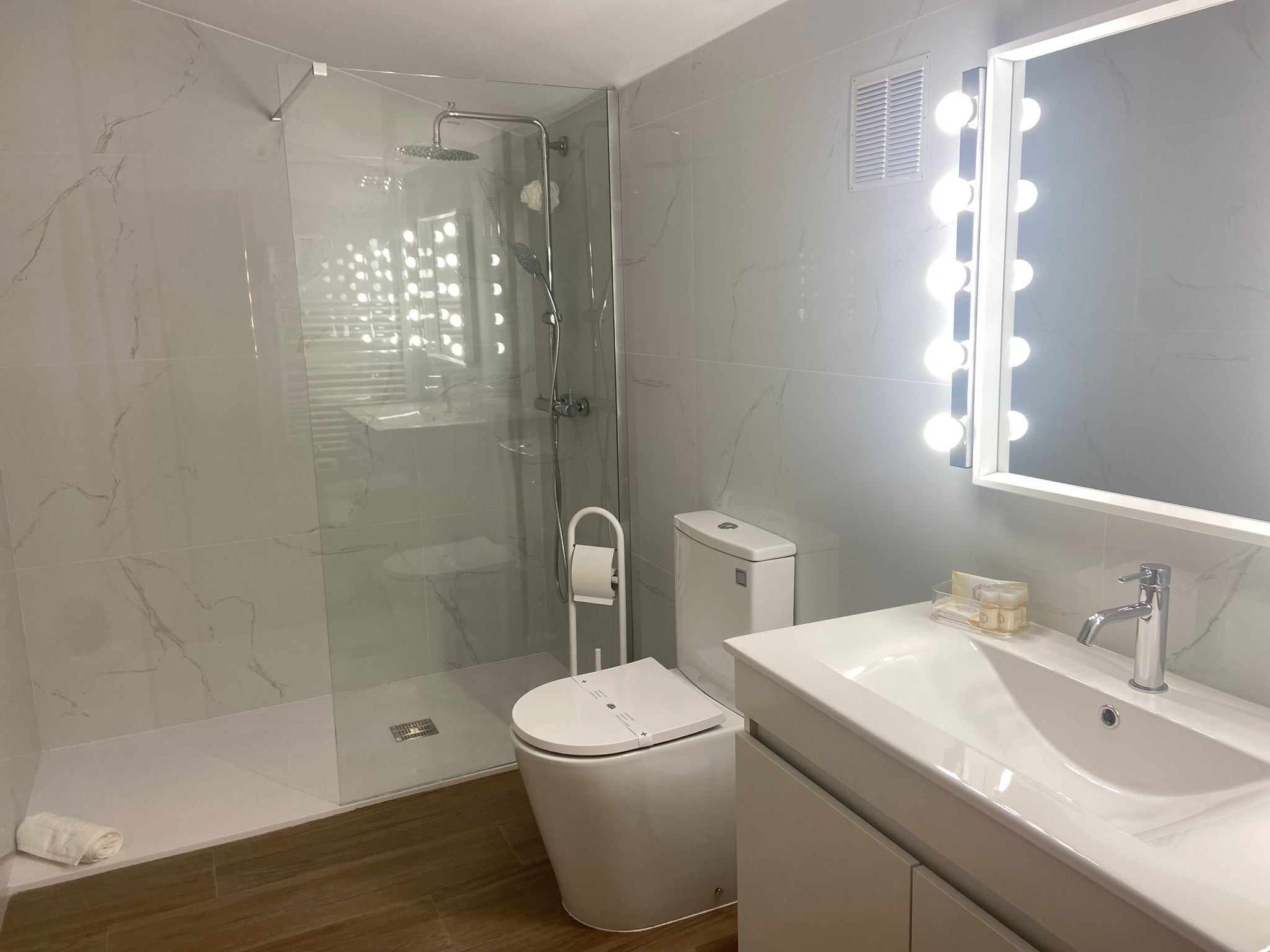 Shower, hair dryer, towels, soap