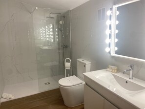 Shower, hair dryer, towels, soap