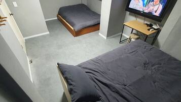 Deluxe Quadruple Room, 2 Double Beds | Soundproofing, free WiFi