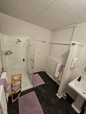 Shower, hair dryer, towels, soap