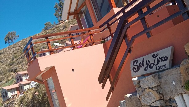 A lodge named "Sely Luna" with a stone staircase leading to a wooden deck. - Sol y Luna Lodge Isla del Sol Bolivia (Isla del Sol)