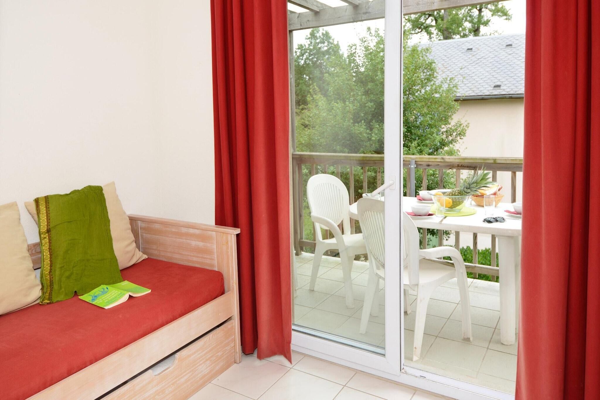 A room with a sliding glass door leading to an outdoor patio area.