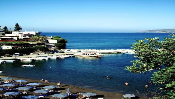 A coastal town with a marina, beach, and buildings along the shore. - Villa in Axos with Pool near Panormo Beach (Axos - Rethymno)