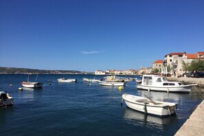 Enjoy waterfront views and a tranquil atmosphere, surrounded by boats and historic architecture.
