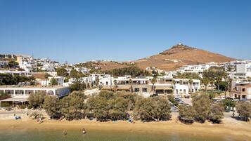 Stunning coastal town with residential homes, commercial establishments, and a beautiful beach.