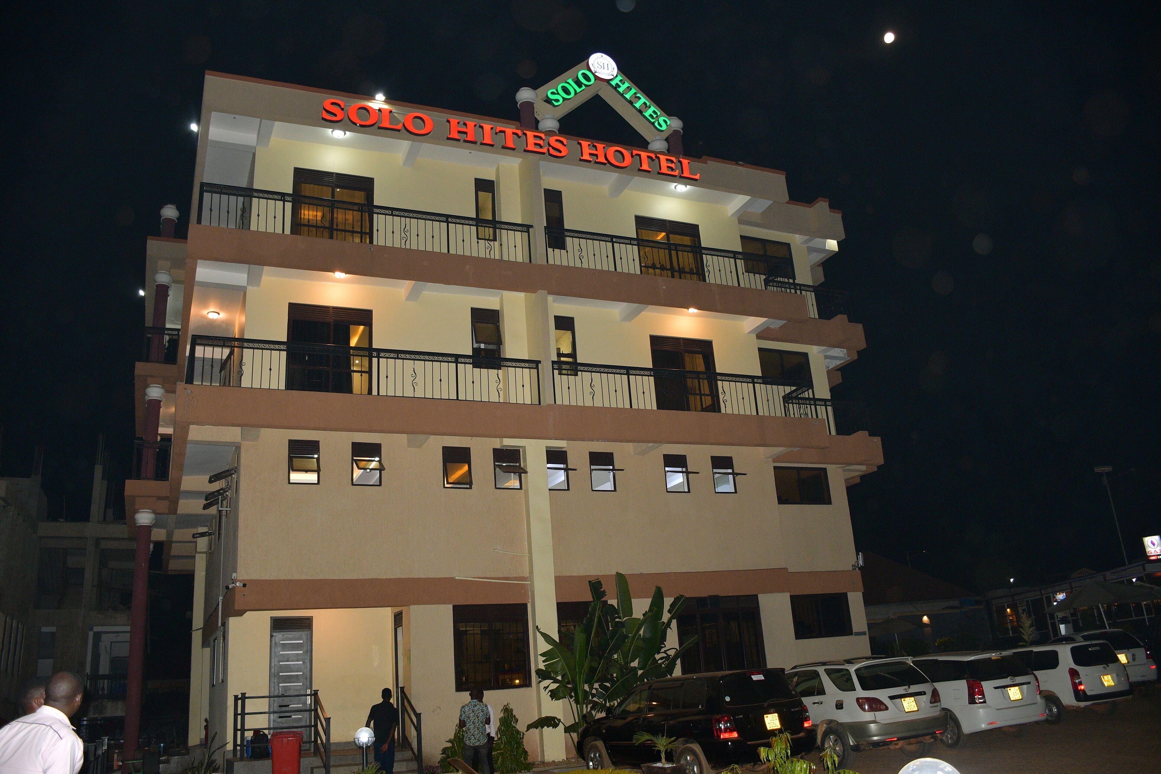 A multi-story hotel with balconies and a sign reading "Solo Hites Hotel".