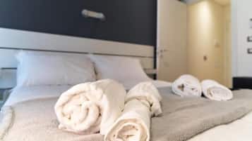 Premium bedding, down comforters, individually decorated