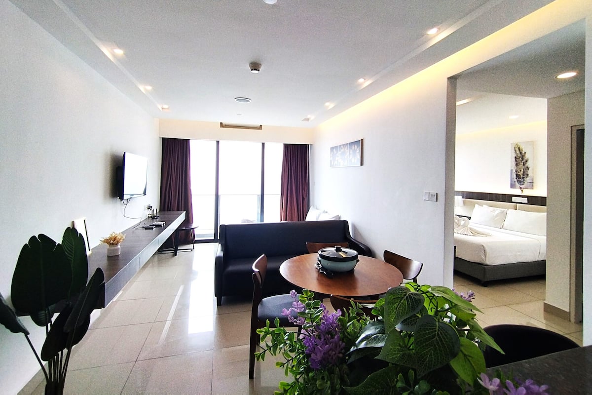 Deluxe Apartment | Living area | 50-inch Smart TV with cable channels
