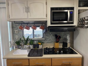 Fridge, microwave, stovetop, coffee/tea maker